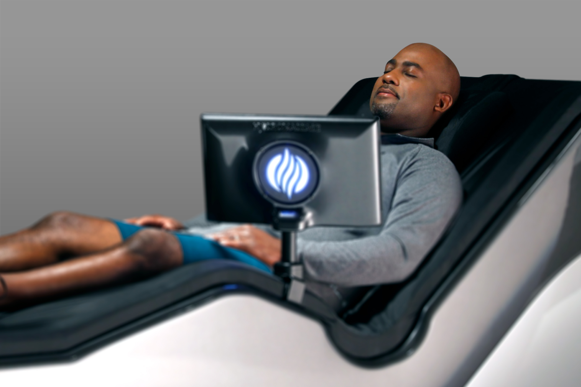 Man laying on HydroMassage Lounge